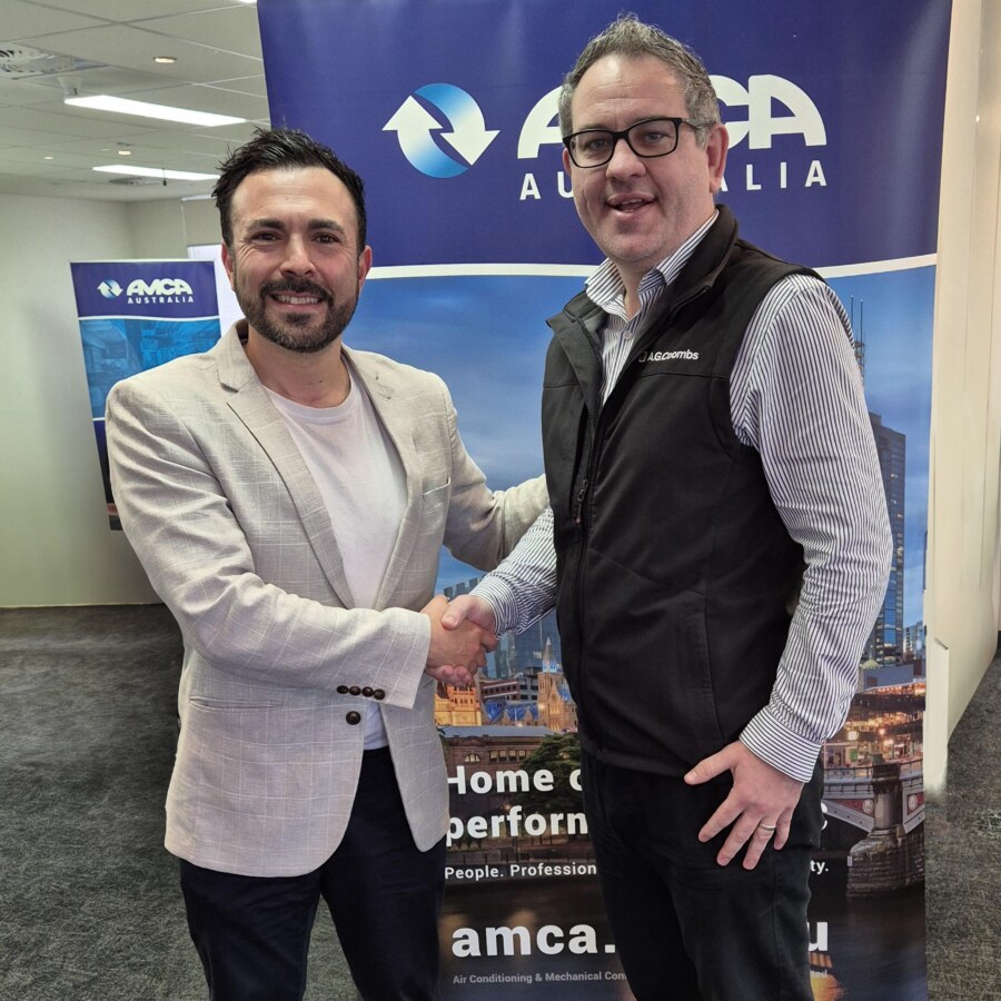 2024 AMCA Australia Managing for Profit Scholarship-winner Michael Roberts being congratulated by AMCA Australia National Training Manager John Castillo.